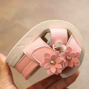 Stylish pink girls sandals with floral accents and soft white sole for summer 2025
