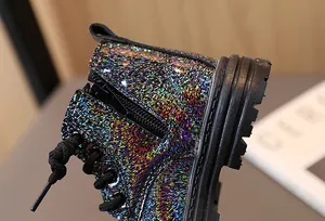 Detailed view of children's glitter Martin boots with side zipper and durable sole