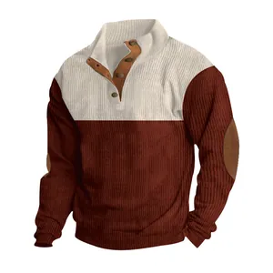 Close-up of men's corduroy color-block mock neck sweatshirt with brown button trim.