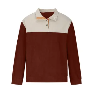 Detail view of the brown and beige colorblock corduroy sweatshirt with button collar.