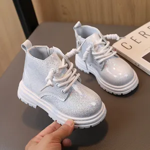 Trendy glitter silver children's Martin boots with durable non-slip thick soles.