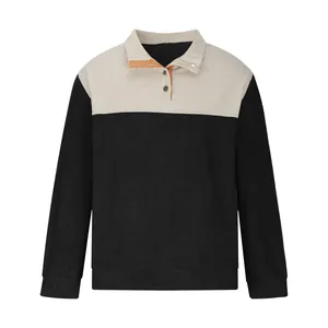 Detail of men's two-tone corduroy sweatshirt with button collar and textured fabric