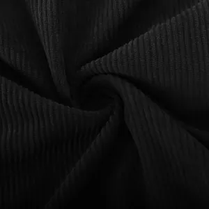 Macro close-up view of premium black corduroy fabric texture for men's casual shirts.