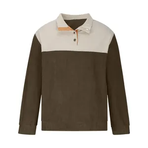 Detailed macro view of men's two-tone corduroy shirt featuring button polo collar