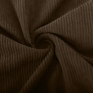 Macro close-up showing the soft and thick texture of dark brown corduroy shirt fabric.