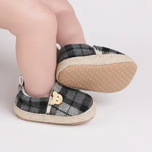 Close-up of British style plaid baby walker shoes featuring a soft non-slip sole design