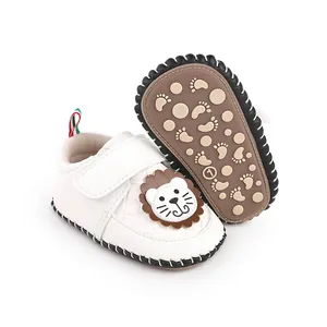 Detailed view of white baby walker shoes featuring a cartoon lion and anti-slip sole