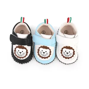 Close-up of three soft-soled baby walking shoes featuring cute lion cartoon designs
