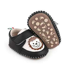 Detail view of black and white cartoon lion baby walking shoes with non-slip rubber sole