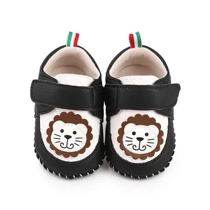 Detailed view of cartoon lion infant walking shoes with soft soles and velcro straps.