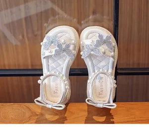 White girls' summer sandals with elegant pearl and butterfly rhinestone details.