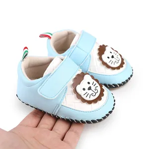 Close-up of baby walking shoe with cute cartoon lion and velcro strap