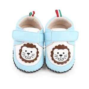 Close-up of light blue baby walker shoes featuring a cute cartoon lion embroidery