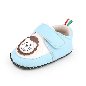 Detailed side view of a light blue baby walking shoe with a cute cartoon lion design