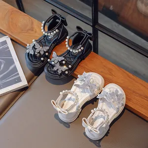 Elegant girls' summer sandals featuring rhinestone butterflies, pearls, and a stylish bow heel