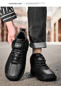 Detail view of black hand-stitched men's casual leather shoes with lace-up design