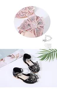 Detail view of girls' princess shoes with rhinestone butterfly and pearl strap