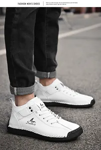 Detail of white hand-stitched leather shoes for men on outdoor street background