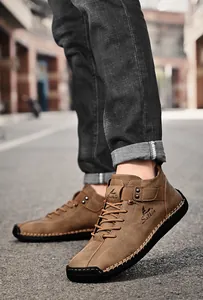 Macro view of brown men's casual leather shoes showing exquisite handmade stitching