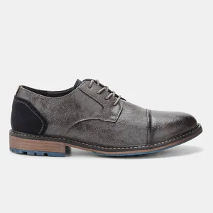 Detailed view of men's business casual dress shoe with rub-off leather finish.