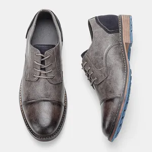 Top view of men's burnished brown leather formal shoes with cap-toe detail