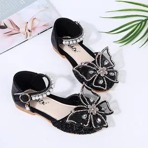 Elegant black girls princess dress shoes featuring rhinestone butterfly and pearl straps