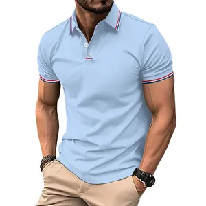 Detail of light blue men's polo shirt featuring red and blue striped collar trim