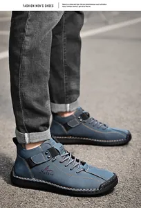 Close-up of blue handmade stitched casual leather men's shoes in outdoor street setting