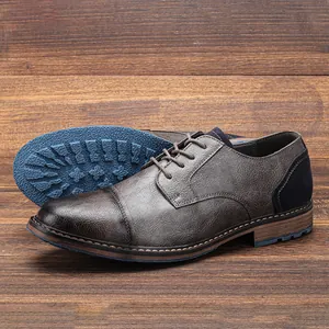Elegant men's formal business dress shoes with textured leather and a blue non-slip sole.