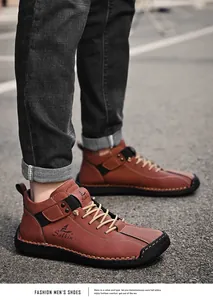 Close-up of brown hand-stitched leather casual shoes for men featuring unique side stitching