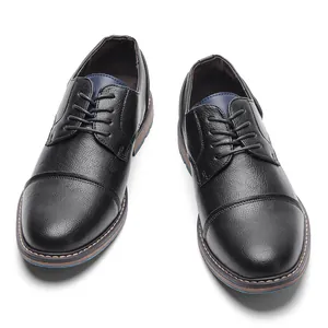 Elegant men's black pebbled leather cap-toe dress shoes for professional business wear