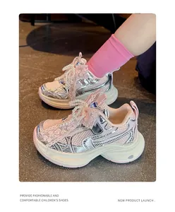Detailed shot of girls' pink chunky sneakers with pearl lace and breathable mesh