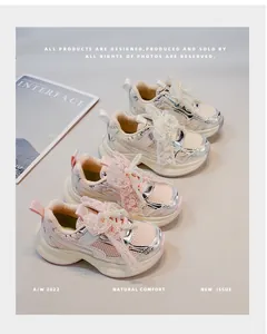 Close-up detail of girls' mesh sports sneakers featuring elegant pearl and lace bow decorations.