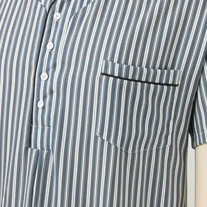 Close-up of men's striped nightgown with white buttons and black piped chest pocket