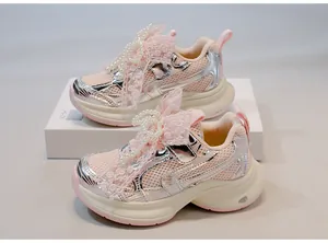 Detail view of pink girls sneakers featuring lace, pearls, and breathable mesh fabric.