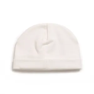 Close-up detail view of a soft white cotton baby beanie featuring a folded cuff design