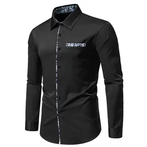 Detail of black men's casual shirt with blue paisley patchwork on collar and pocket