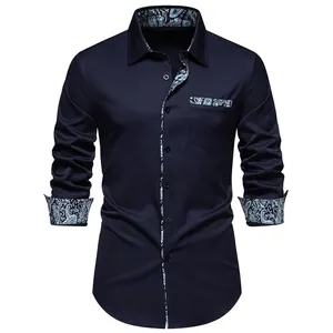 Detail view of a men's navy long sleeve shirt featuring stylish paisley patterned accents.