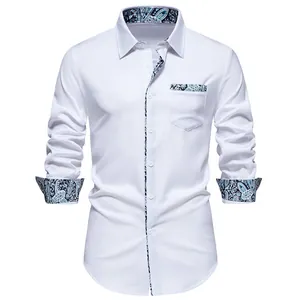 Detail of white men's casual long sleeve shirt featuring elegant blue paisley patchwork