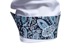 Detailed macro view of white shirt cuff featuring an elegant blue paisley pattern lining