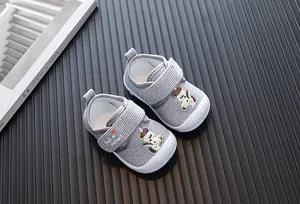 Grey corduroy baby walking shoes with cartoon horse decoration and Velcro straps