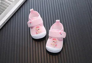Detailed view of pink toddler shoes with cartoon elephant applique and ribbed textile texture