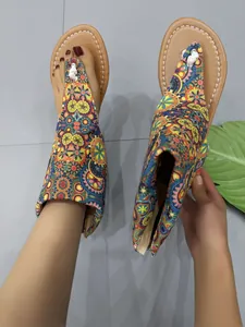 Detailed view of bohemian ethnic mandala print flat thong sandals with stylish ankle wrap