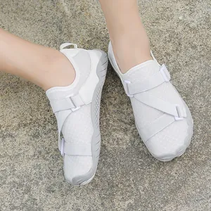 Breathable white wading shoes with cross straps and non-slip soles for outdoor activities