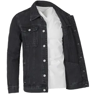 Detail view of men's casual vintage black washed denim jacket layered with a white tee
