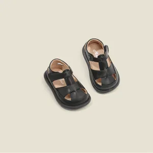 Schwarze Lauflernschuhe aus Kunstleder mit T-Riemen für Baby Jungen und Mädchen