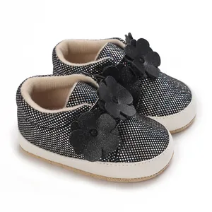 Chaussures bébé noires pailletées avec fleurs et semelles souples pour les 0-1 an