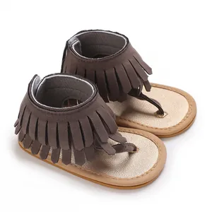 Stylish baby fringe sandals in brown with gold insoles and a comfortable flip-flop design