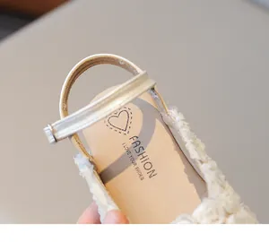 Detailed close-up of cream girls' floral princess sandals with a comfortable heel strap