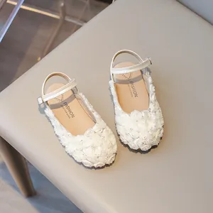 White princess-style girls sandals with intricate rose flower design and ankle strap